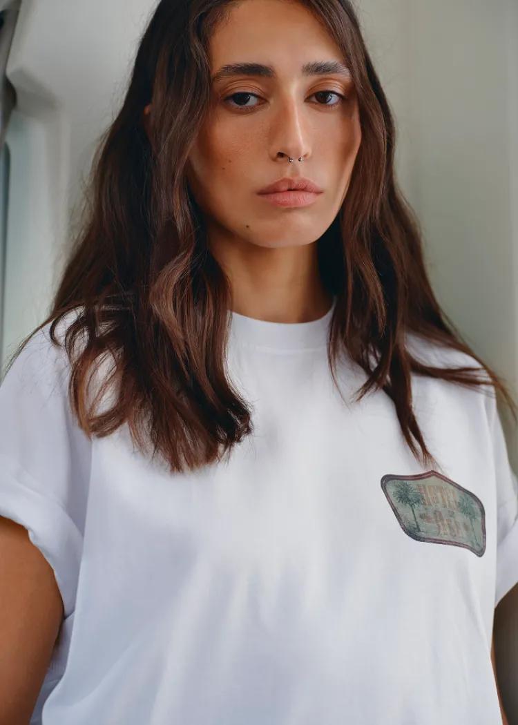 White t-shirt green logo Hotel